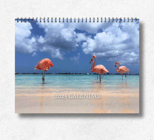 2025 Flamingo calendar featuring four flamingos in a beautiful beach background with clear blue sea.